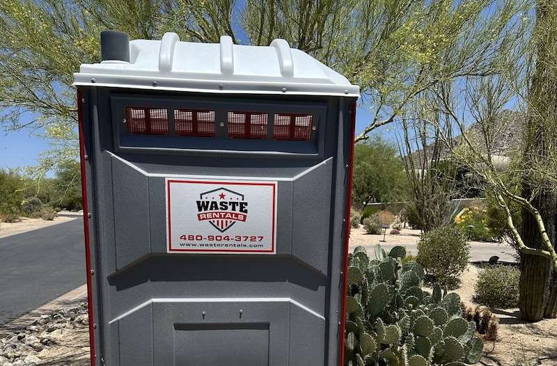Waste Rentals portable toilet on site in a Phoenix neighborhood.